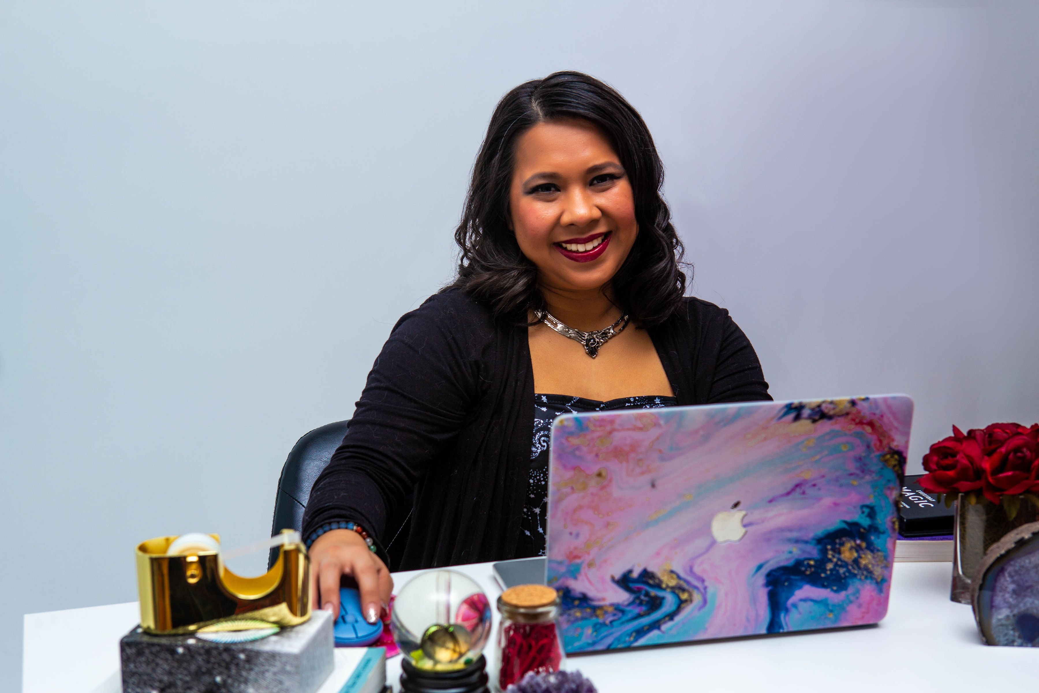 Dr. Rowena Winkler at Desk Smiling